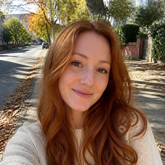 An everyday phone photo of a person smiling